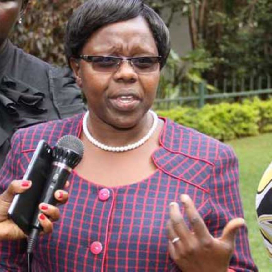 Nandi County Deputy Governor Dr. Yulita Mitei demonstrates tree seeds planting during the launching of 10,000 tree nursery beds at Kaiboi Technical Training Institute