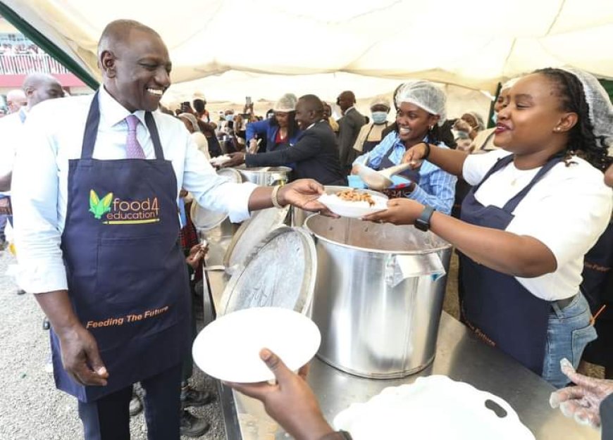 Ruto serves pupils lunch